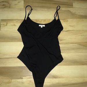 Cross over snap crotch body suit